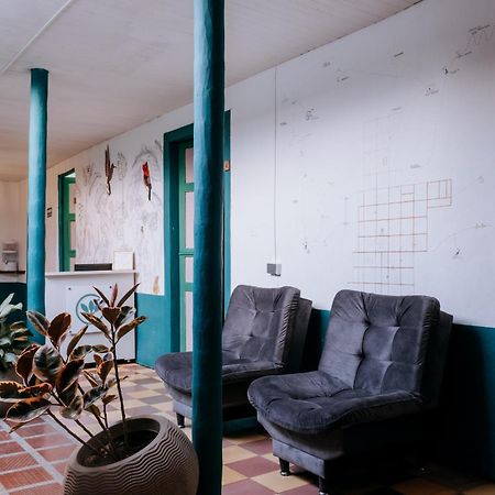 Origen Hostel Jardin Bagian luar foto