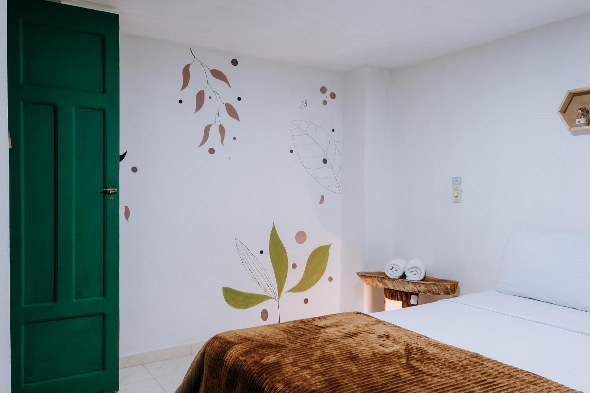 Origen Hostel Jardin Bagian luar foto